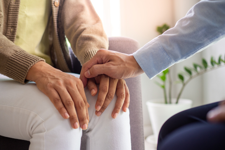 Therapist Provides Help and Encouragement to Female Patient